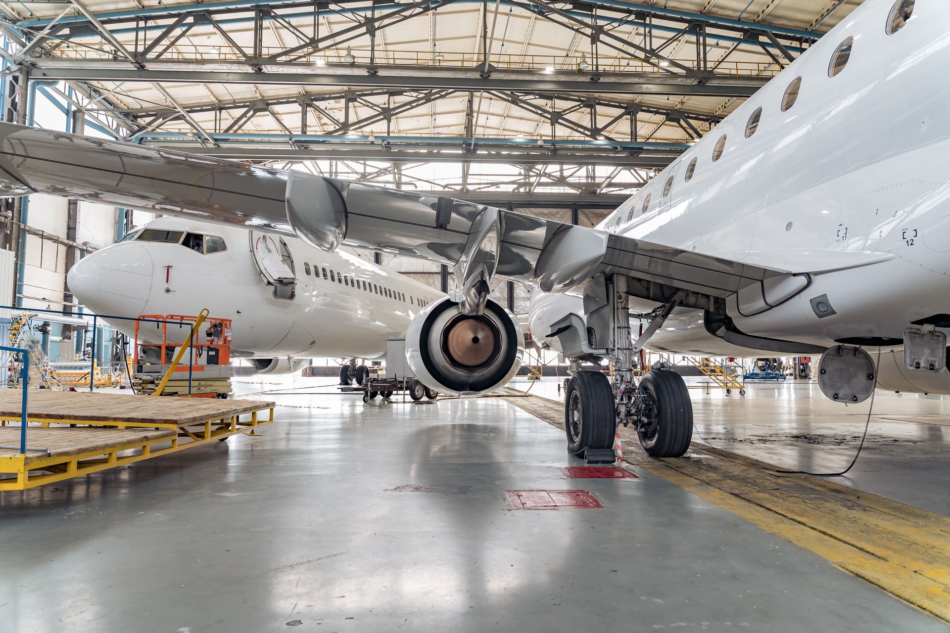 Panoramic view of aerospace hangar with planes